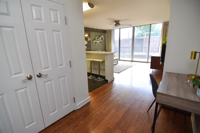 interior space with hardwood / wood-style flooring and expansive windows