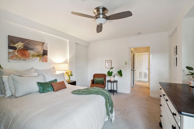 bedroom featuring ceiling fan and light carpet