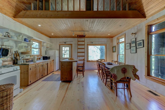 kitchen with track lighting, light hardwood / wood-style floors, white appliances, and wooden ceiling