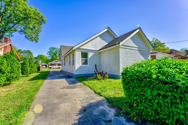 view of home's exterior with a lawn