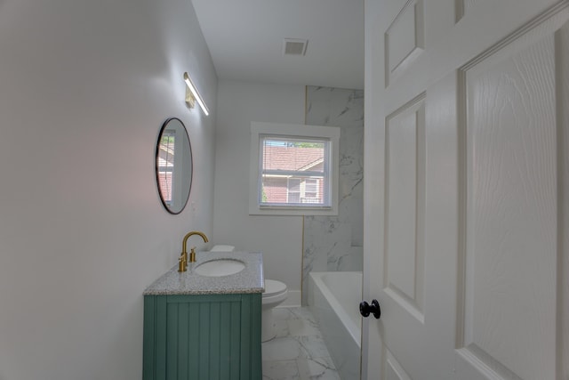 bathroom with toilet, tile floors, and vanity