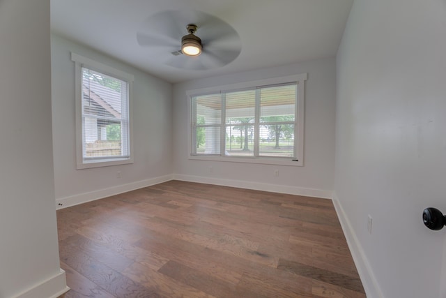 spare room with hardwood / wood-style floors and ceiling fan