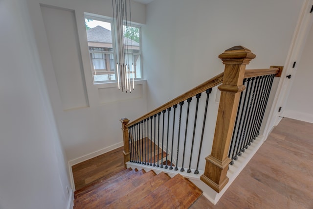 stairs featuring wood-type flooring