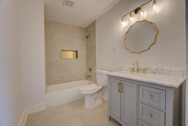 full bathroom featuring tiled shower / bath combo, vanity, toilet, and tile flooring