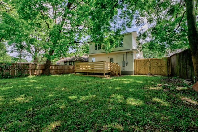 view of yard featuring a wooden deck