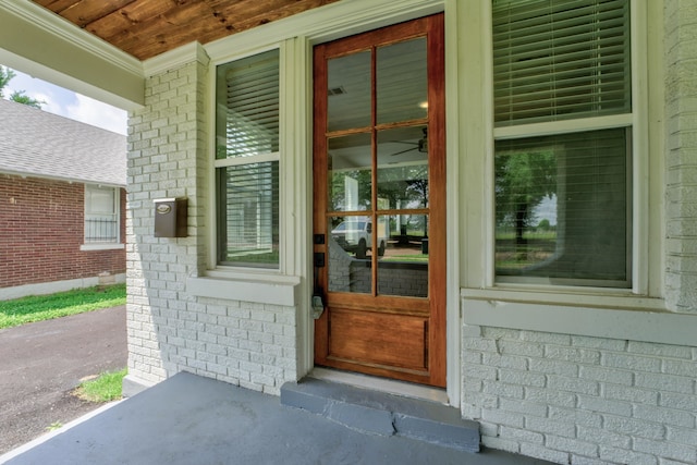 view of exterior entry featuring a porch