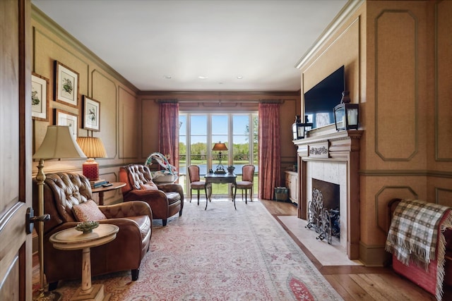 living room with light wood-type flooring and a premium fireplace