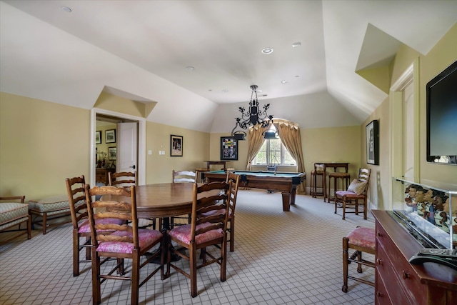 carpeted dining space with lofted ceiling, an inviting chandelier, and pool table