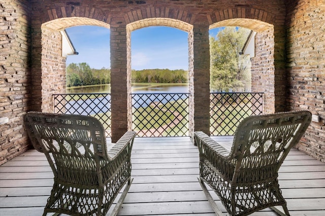 balcony featuring a water view