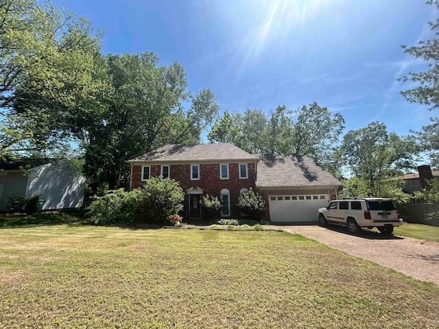 view of front of home featuring a garage and a front lawn