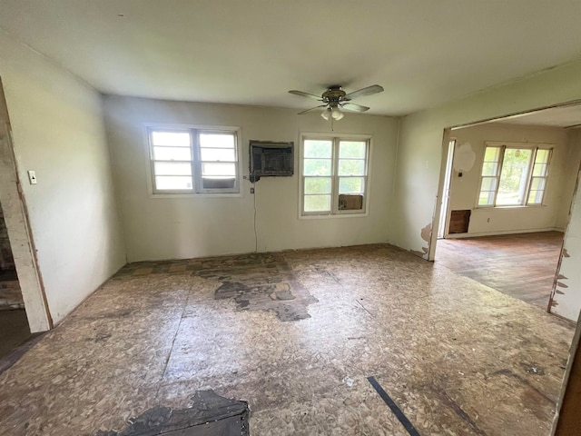 unfurnished room with a wealth of natural light and ceiling fan