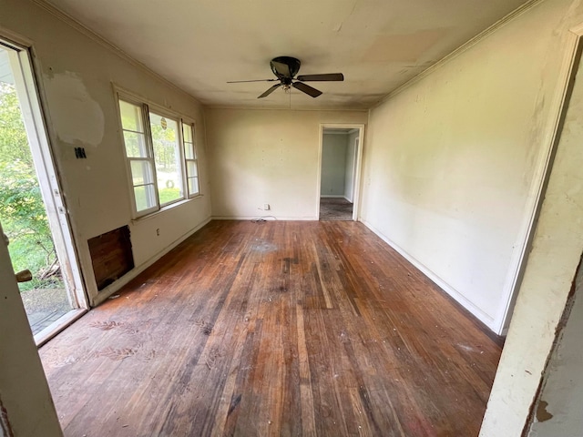 empty room with hardwood / wood-style floors and ceiling fan