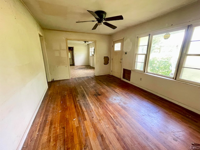 empty room with wood-type flooring and ceiling fan