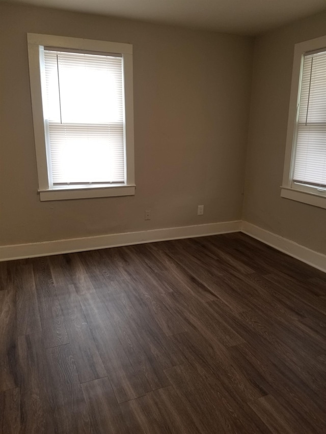 unfurnished room featuring dark hardwood / wood-style floors