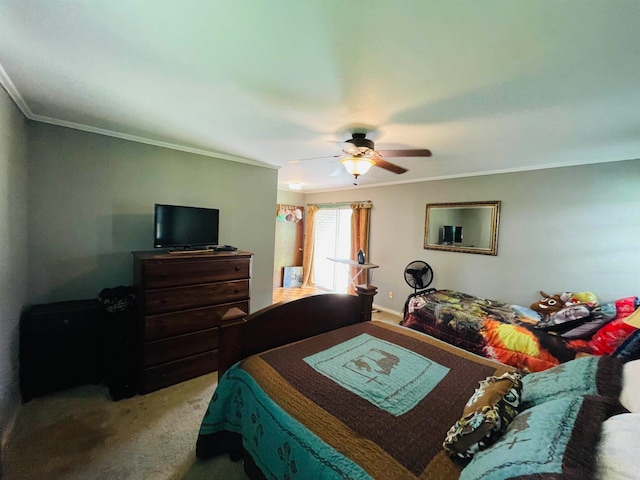 bedroom with ornamental molding, ceiling fan, and carpet flooring