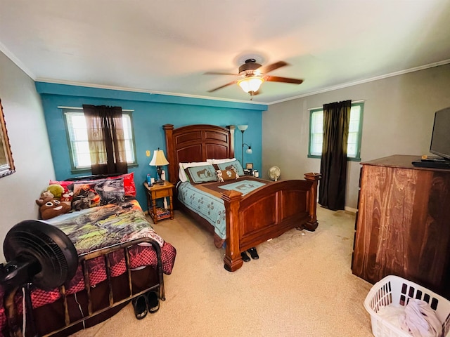 bedroom featuring ceiling fan, carpet, and crown molding