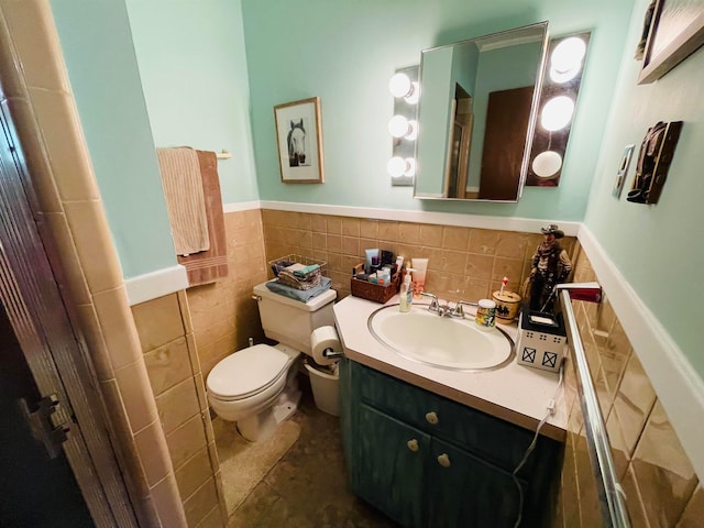 bathroom featuring vanity, toilet, tile walls, and decorative backsplash