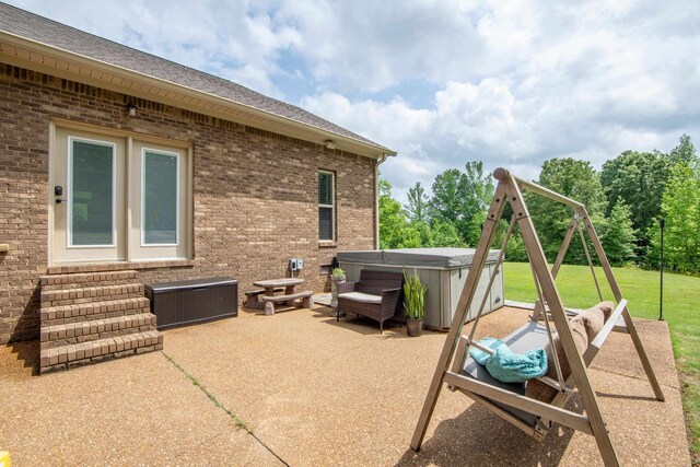 view of terrace featuring a hot tub