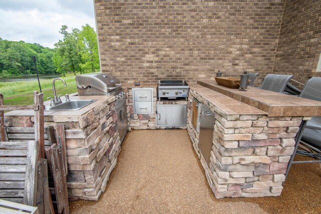 view of patio / terrace with sink and exterior kitchen