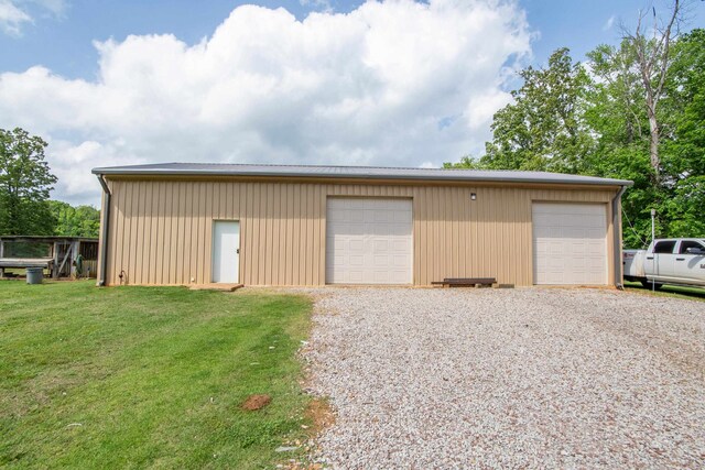 garage featuring a lawn