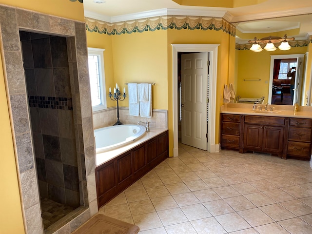 bathroom with tile floors, ornamental molding, independent shower and bath, and vanity