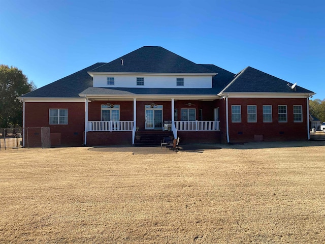 view of front of property with a front yard and a porch