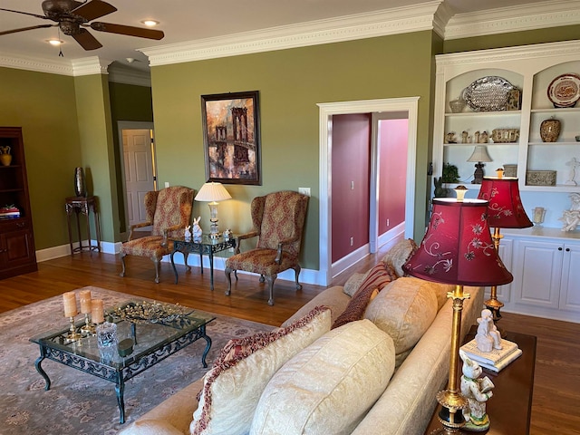 living room featuring ceiling fan, hardwood / wood-style flooring, and crown molding