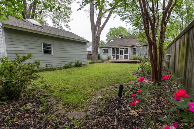 view of yard with a wooden deck