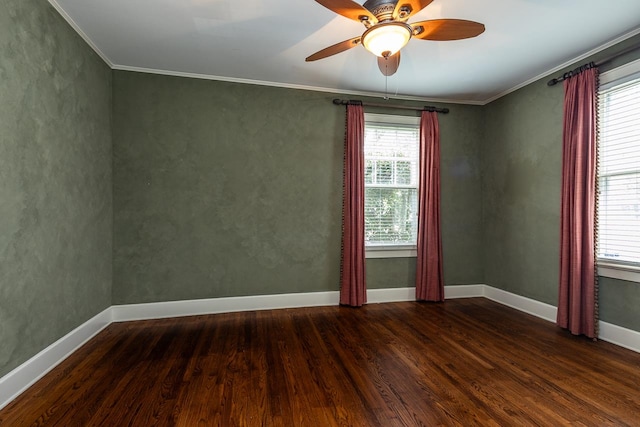 empty room with ceiling fan, a healthy amount of sunlight, and dark hardwood / wood-style floors