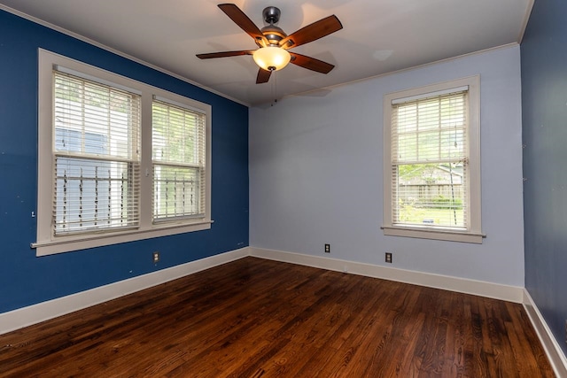 unfurnished room with crown molding, dark wood-type flooring, and ceiling fan