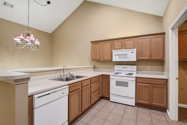 kitchen featuring decorative light fixtures, white appliances, light tile flooring, a notable chandelier, and sink