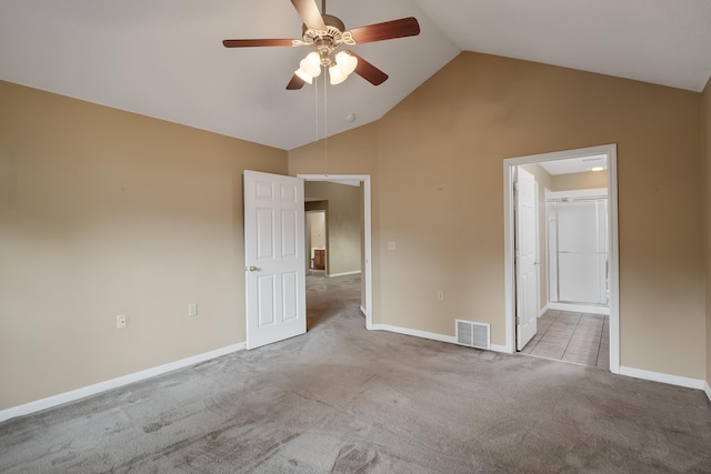 spare room featuring high vaulted ceiling, ceiling fan, and tile floors