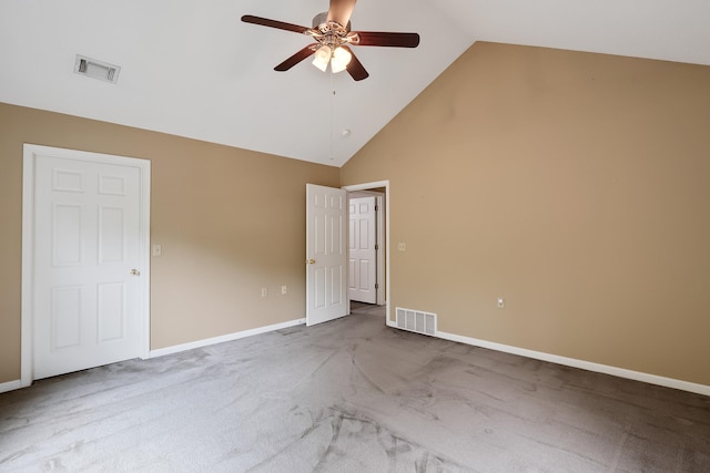 carpeted spare room with high vaulted ceiling and ceiling fan