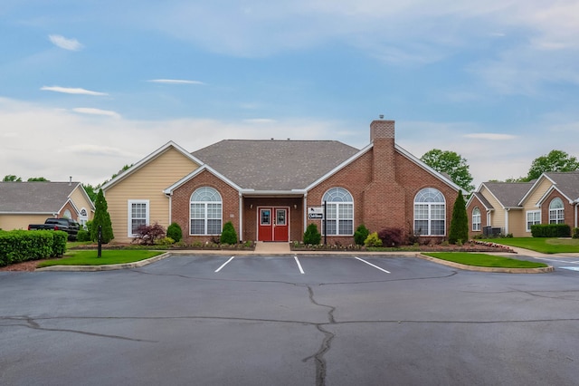 ranch-style house with central air condition unit