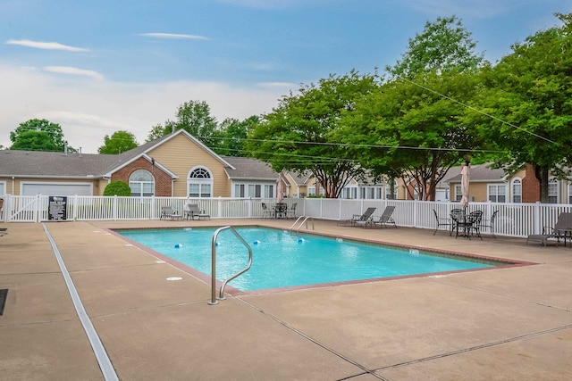 view of swimming pool with a patio