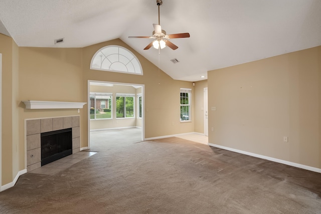 unfurnished living room with high vaulted ceiling, a fireplace, carpet floors, and ceiling fan