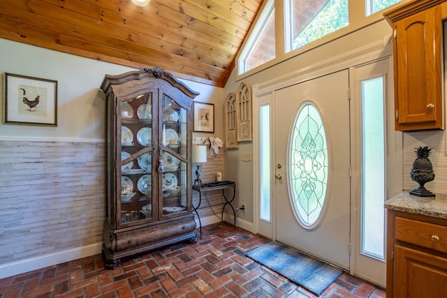 entryway with high vaulted ceiling and wood ceiling