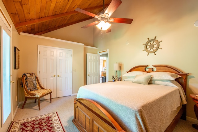 bedroom featuring a closet, ceiling fan, wood ceiling, light colored carpet, and beam ceiling