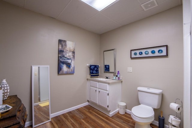 bathroom featuring hardwood / wood-style floors, vanity, and toilet