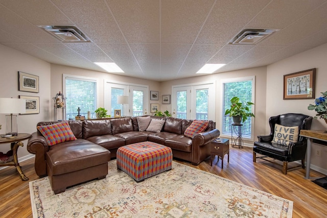 living room featuring hardwood / wood-style flooring and french doors