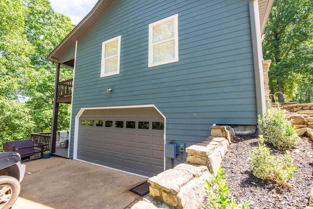 view of side of home with a garage