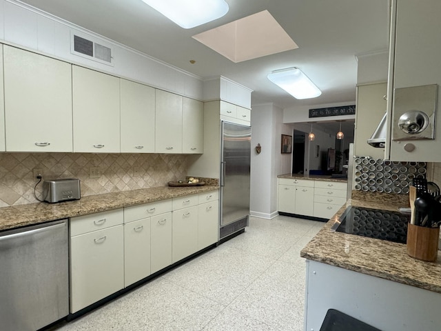 kitchen with stone counters, stainless steel appliances, crown molding, tasteful backsplash, and light tile floors