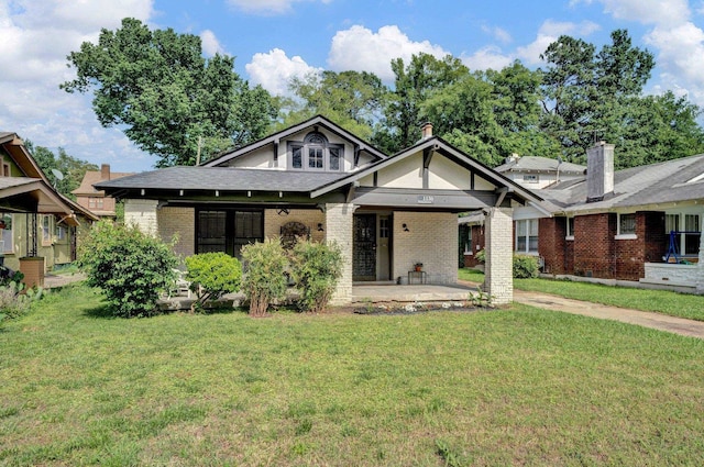 view of front of property with a patio area and a front yard