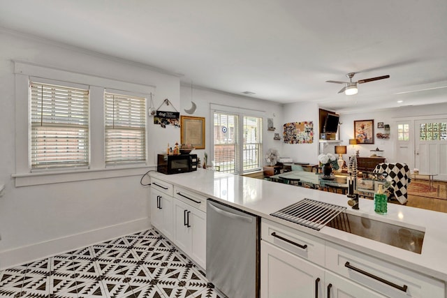 kitchen featuring a healthy amount of sunlight, white cabinetry, dishwasher, and ceiling fan