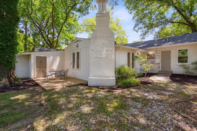 back of property featuring a patio area