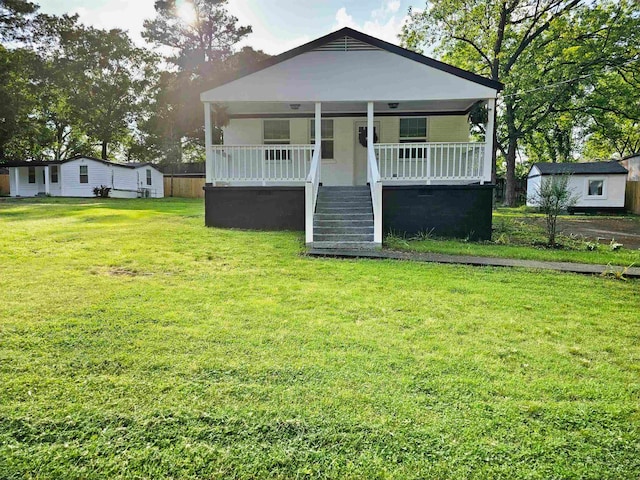 bungalow-style home featuring a porch and a front lawn