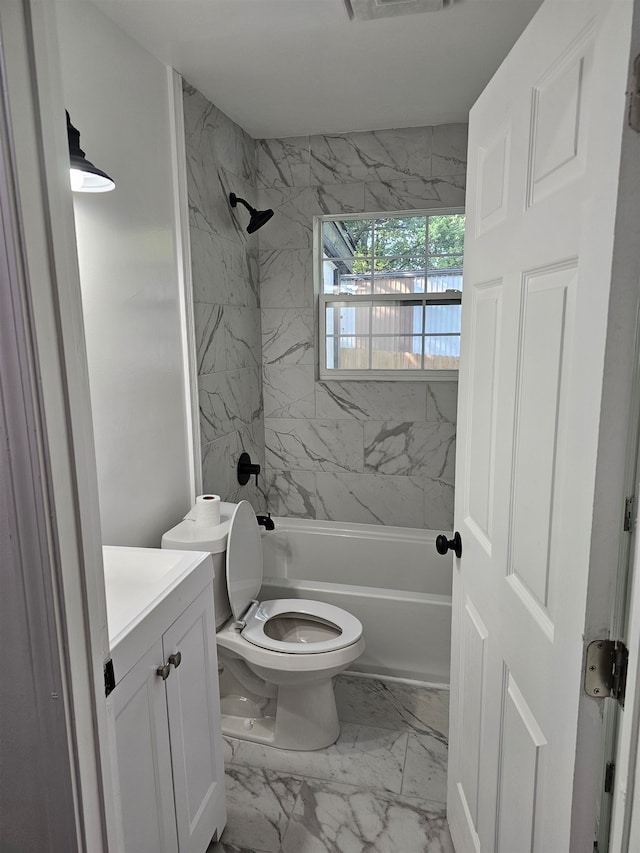 5907 Old Millington Rd, Millington, TN 38053 - full bathroom featuring vanity, tiled shower / bath combo, and toilet