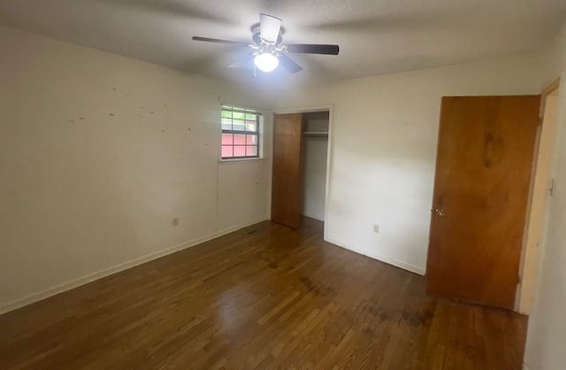 spare room featuring ceiling fan and dark hardwood / wood-style floors