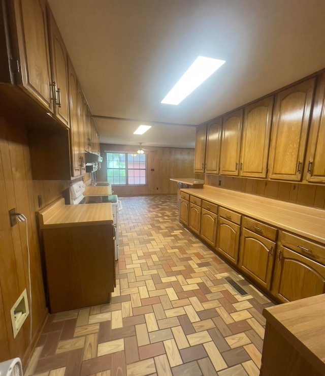 kitchen with wood counters and stove