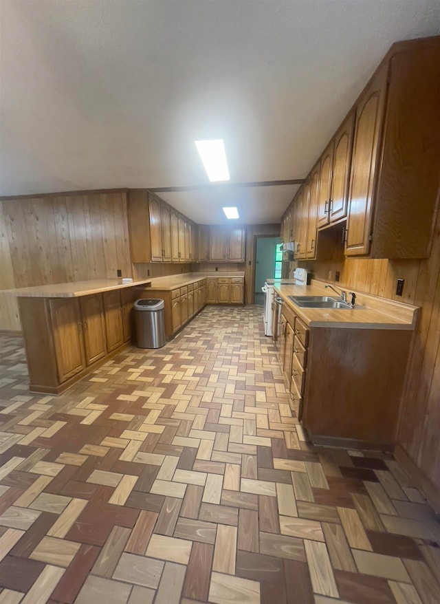 kitchen featuring sink and light parquet flooring